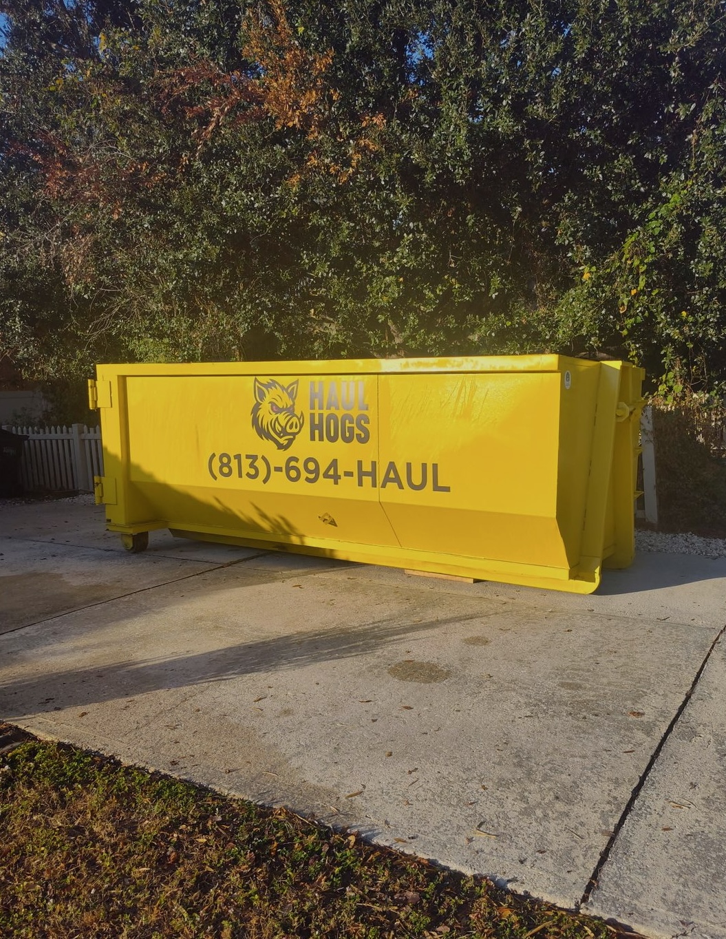 Haul Hogs 20-yard dumpster delivered to a Tampa driveway