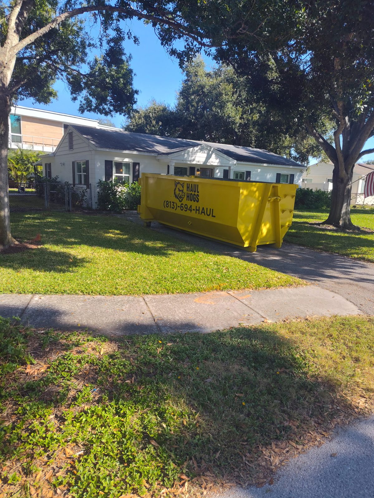 Yellow Haul Hogs dumpster at a Clearwater home